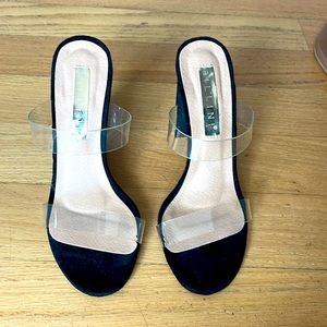 Clear strapped, black base heel
